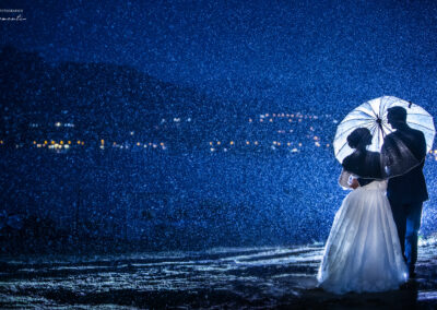 Wedding couple under rain